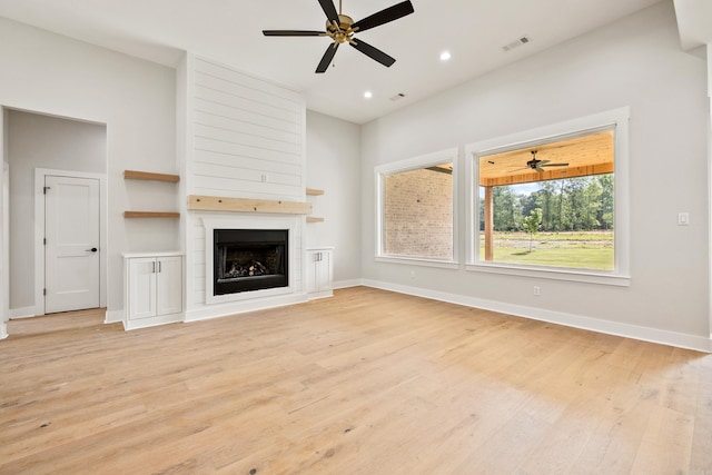 6172 Majestic Waters Dr, Alexander, AR 72002 - unfurnished living room featuring ceiling fan, light wood finished floors, baseboards, a large fireplace, and recessed lighting