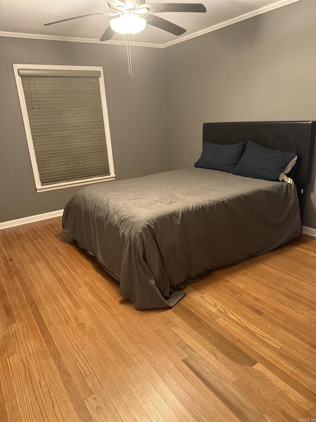 230 Berg Ave, Camden, AR 71701 - bedroom with light wood-type flooring, crown molding, ceiling fan, and baseboards