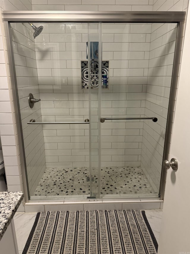 230 Berg Ave, Camden, AR 71701 - full bathroom with marble look tiles and a shower stall