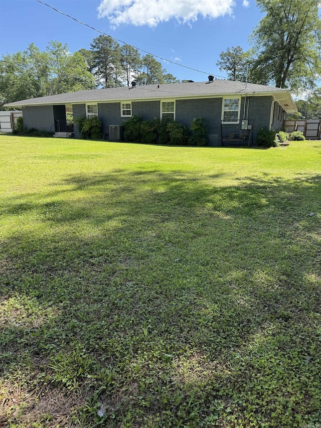 230 Berg Ave, Camden, AR 71701 - rear view of property with central AC unit and a yard