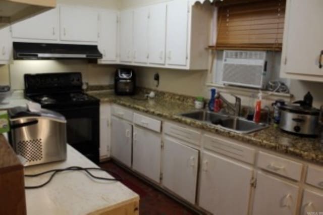 kitchen featuring white cabinets, a sink, black electric range, and under cabinet range hood