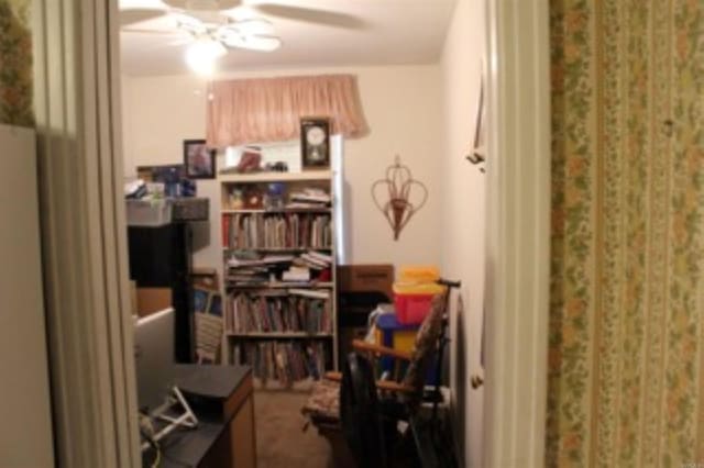 interior space featuring a ceiling fan
