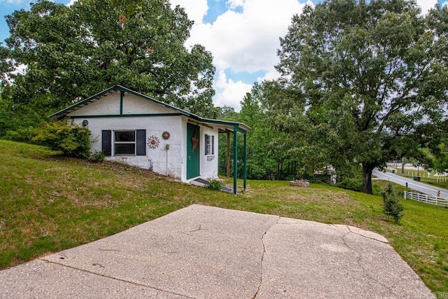 view of front facade with concrete block siding