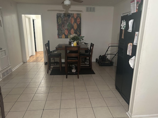 400 Oxford St, West Memphis, AR 72301 - dining area with crown molding, light tile patterned floors, ceiling fan, visible vents, and baseboards