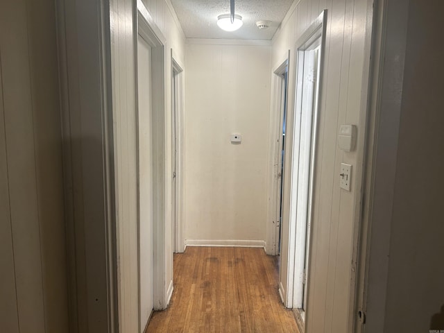 400 Oxford St, West Memphis, AR 72301 - hall featuring ornamental molding, wood finished floors, and a textured ceiling
