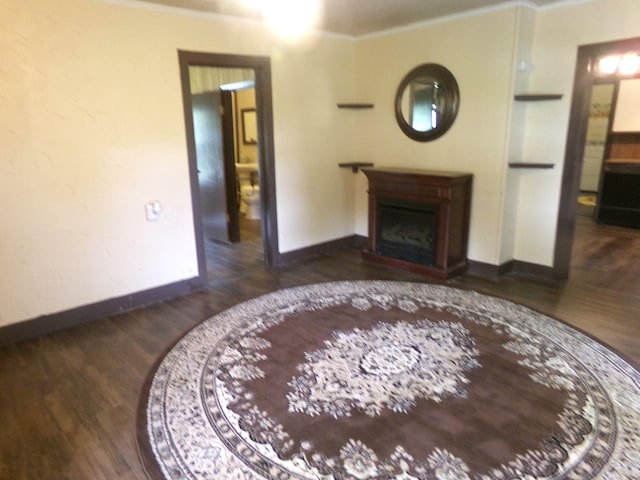 405 S Skaggs Rd, Clarksville, AR 72830 - living area with baseboards, wood finished floors, and a fireplace