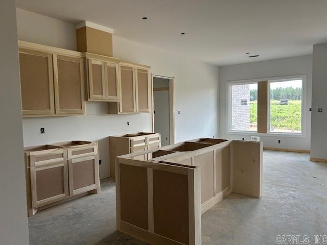 188 Kelton Ln, Hensley, AR 72065 - kitchen with a center island and concrete floors