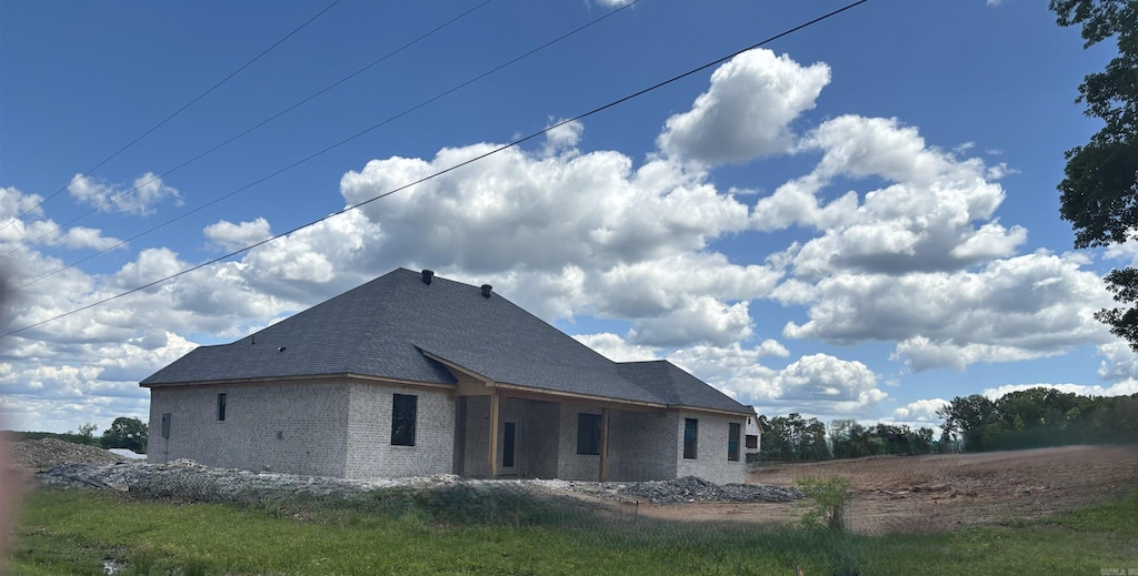 back of house with brick siding
