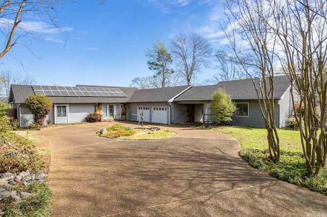 139 Sammie Cv, Hot Springs, AR 71913 - ranch-style house featuring solar panels, a garage, driveway, and roof with shingles