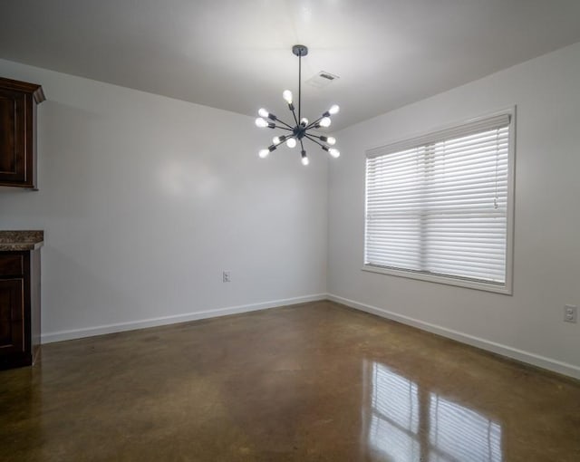 unfurnished dining area featuring a chandelier, visible vents, baseboards, and finished concrete flooring