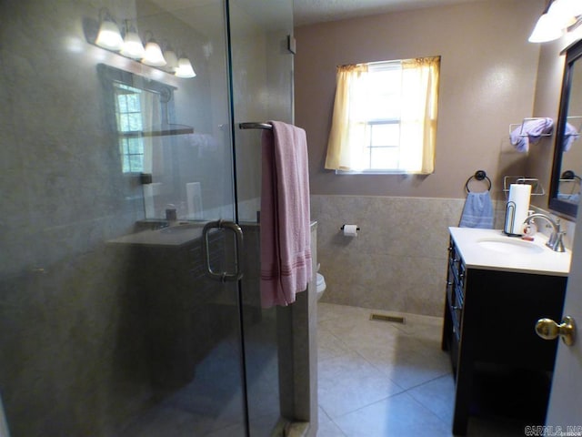 302 Veranda, Pearcy, AR 71964 - full bath featuring visible vents, tile walls, tile patterned flooring, vanity, and a stall shower