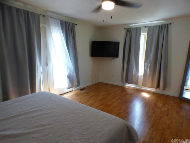 302 Veranda, Pearcy, AR 71964 - unfurnished bedroom with visible vents, baseboards, a ceiling fan, and wood finished floors