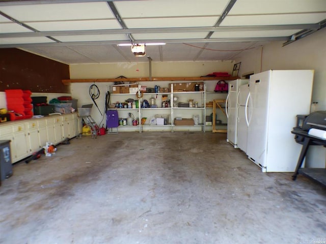 302 Veranda, Pearcy, AR 71964 - garage featuring freestanding refrigerator and a garage door opener