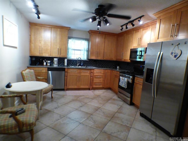 302 Veranda, Pearcy, AR 71964 - kitchen featuring a sink, ceiling fan, dark countertops, appliances with stainless steel finishes, and backsplash