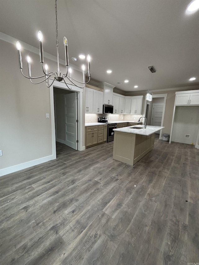 228 Michelle Dr, Beebe, AR 72012 - kitchen with appliances with stainless steel finishes, a sink, a chandelier, recessed lighting, and dark wood-style floors
