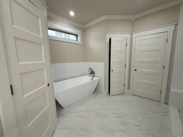 228 Michelle Dr, Beebe, AR 72012 - bathroom featuring a freestanding tub, marble finish flooring, recessed lighting, wainscoting, and crown molding