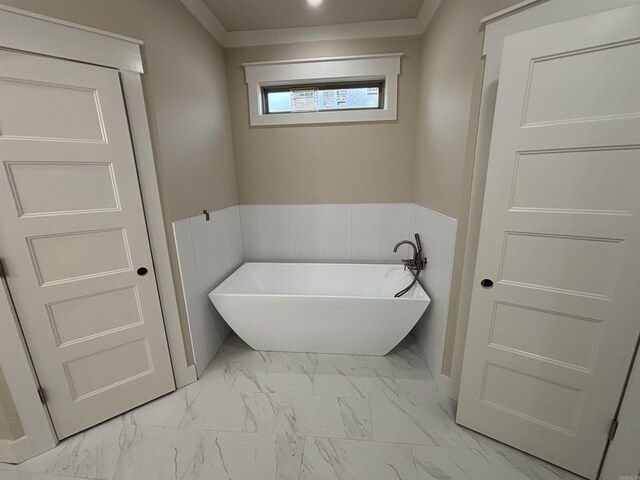 228 Michelle Dr, Beebe, AR 72012 - full bath featuring marble finish floors, a soaking tub, a wainscoted wall, and ornamental molding