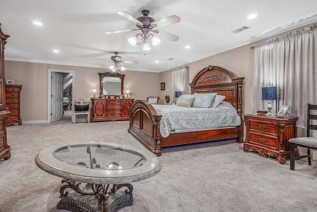bedroom with ornamental molding, visible vents, recessed lighting, and light carpet