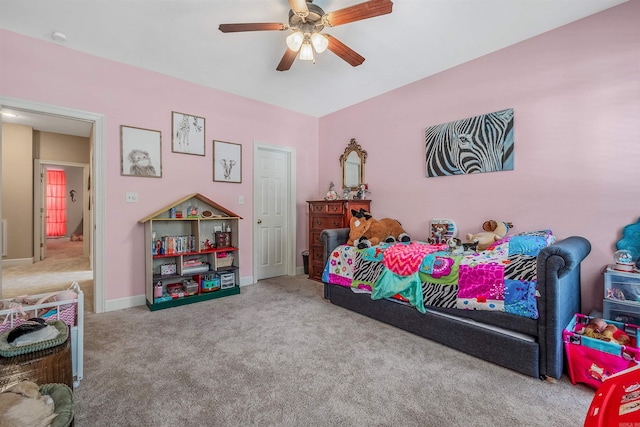 bedroom featuring carpet flooring, baseboards, and a ceiling fan