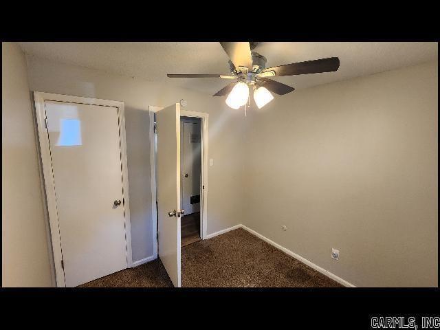 5507 Southboro Ct, Little Rock, AR 72209 - unfurnished bedroom with ceiling fan, baseboards, and carpet floors