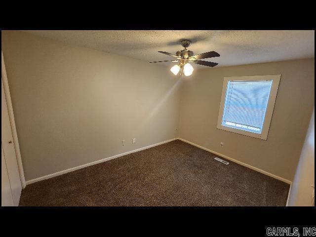 5507 Southboro Ct, Little Rock, AR 72209 - spare room featuring a textured ceiling, a ceiling fan, visible vents, and carpet floors