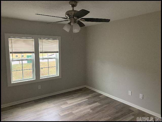 5507 Southboro Ct, Little Rock, AR 72209 - empty room with baseboards, a ceiling fan, and wood finished floors