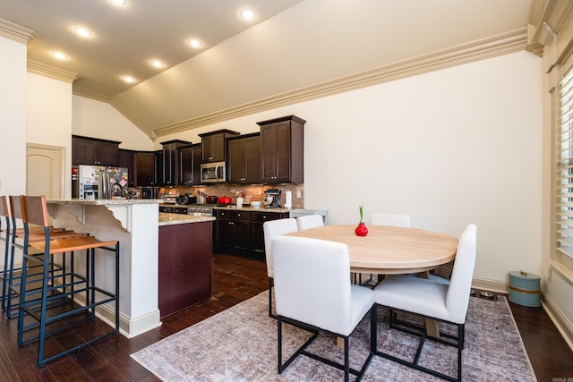 3 Commentry Dr, Little Rock, AR 72223 - kitchen featuring vaulted ceiling, ornamental molding, dark brown cabinets, a kitchen bar, and stainless steel appliances