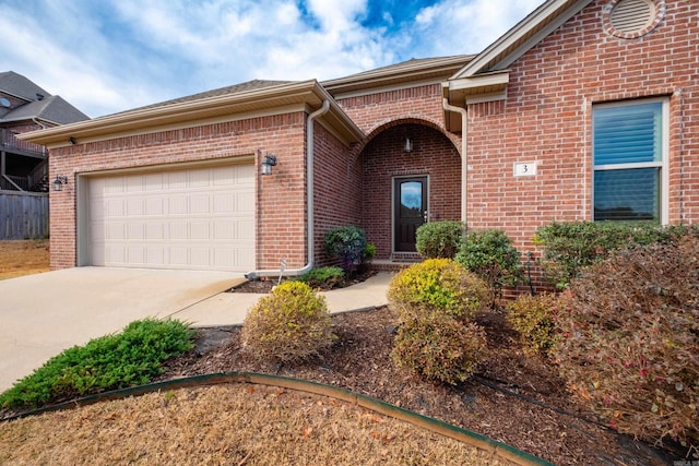 3 Commentry Dr, Little Rock, AR 72223 - view of front facade with concrete driveway, a garage, and brick siding