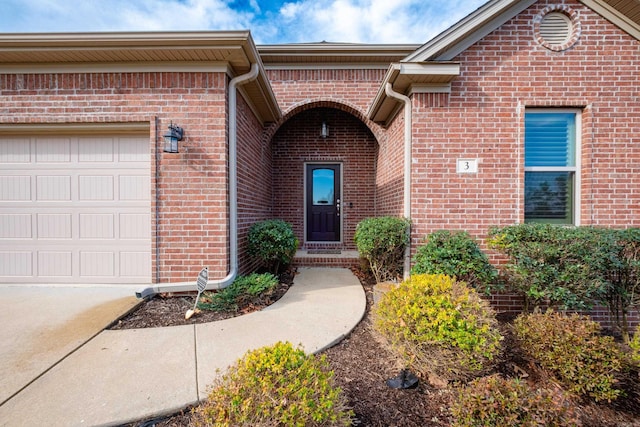 3 Commentry Dr, Little Rock, AR 72223 - view of exterior entry featuring brick siding, a garage, and concrete driveway