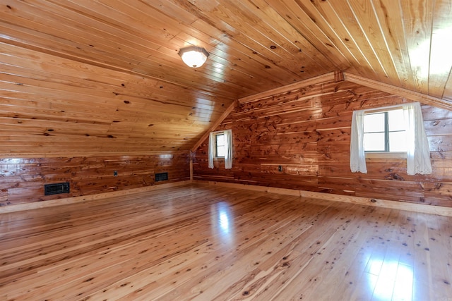 208 Mountain Dr, Perryville, AR 72126 - additional living space with hardwood / wood-style floors, wood walls, and vaulted ceiling