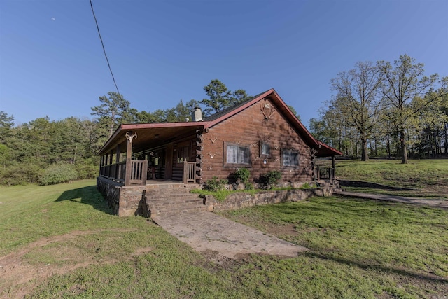 208 Mountain Dr, Perryville, AR 72126 - view of home's exterior with a yard, a porch, log exterior, and a chimney