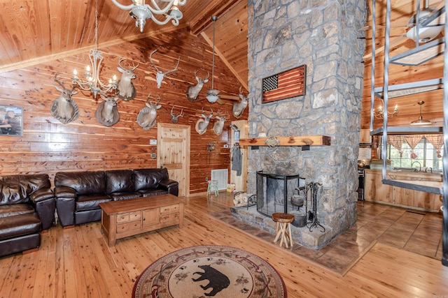 208 Mountain Dr, Perryville, AR 72126 - living area featuring wooden ceiling, an inviting chandelier, wooden walls, beam ceiling, and hardwood / wood-style floors