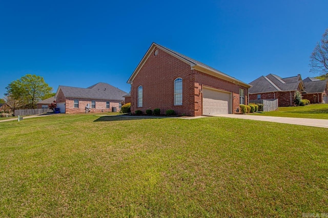 view of front facade with a garage, a front yard, brick siding, and driveway