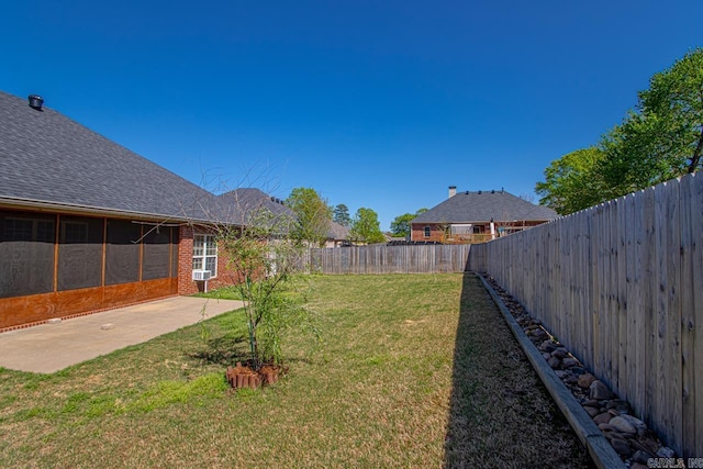 view of yard featuring a patio and a fenced backyard