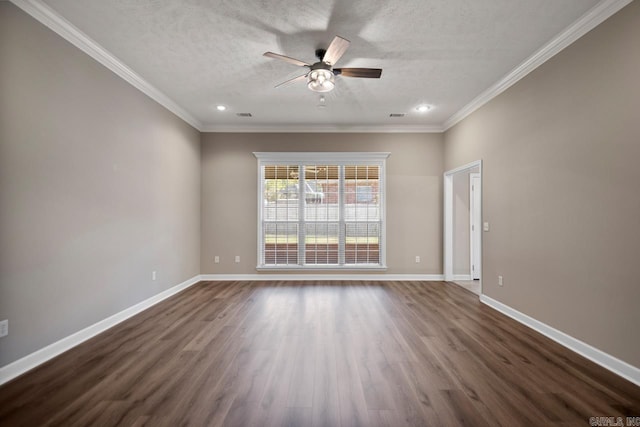 empty room featuring dark wood-type flooring, baseboards, a ceiling fan, and ornamental molding