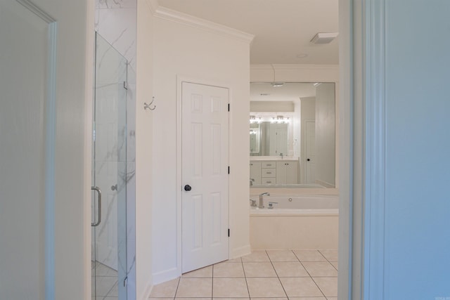 full bath with a shower stall, crown molding, vanity, and tile patterned flooring