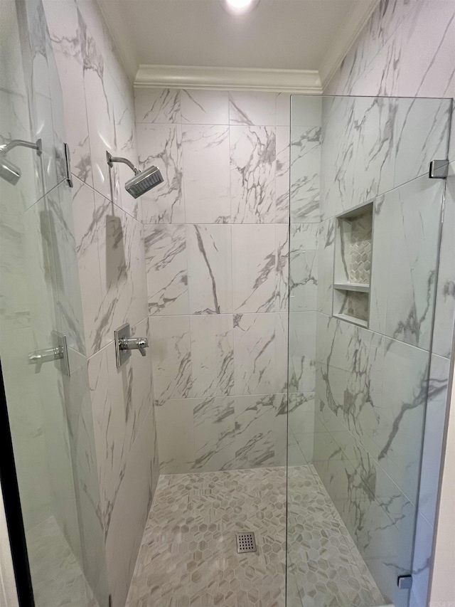 bathroom featuring a shower stall and ornamental molding