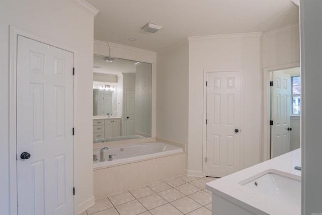 full bathroom with baseboards, crown molding, vanity, tile patterned floors, and a garden tub
