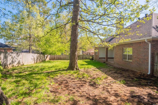 view of yard featuring a fenced backyard