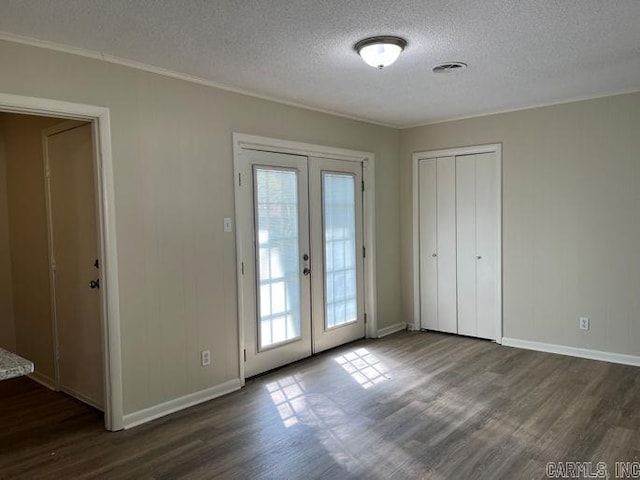 entryway with french doors, visible vents, dark wood-style floors, and plenty of natural light