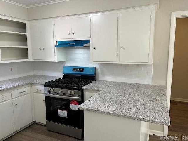 kitchen with white cabinets, under cabinet range hood, dark wood-style flooring, and stainless steel gas range oven