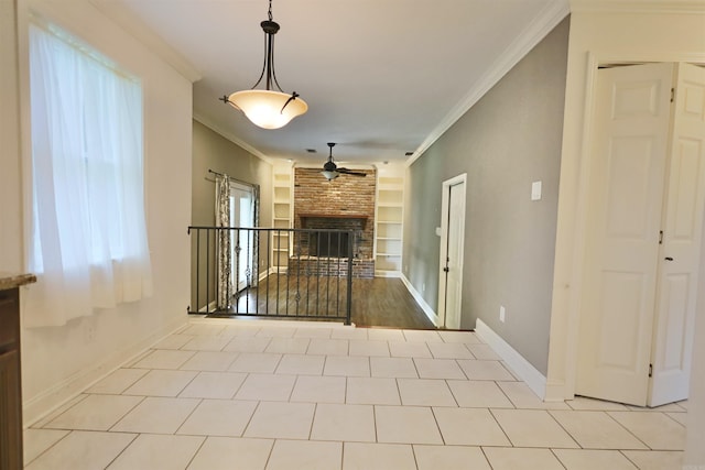 102 Windsor Pl, Hot Springs, AR 71901 - unfurnished living room with ceiling fan, built in features, a fireplace, and crown molding