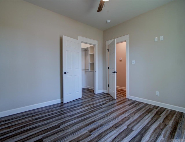 341 Diamondhead Dr, Hot Springs, AR 71913 - unfurnished bedroom with dark wood-style flooring, a closet, baseboards, and a ceiling fan