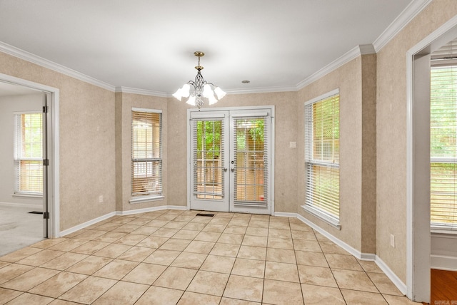 interior space with crown molding, light tile patterned floors, french doors, a notable chandelier, and baseboards