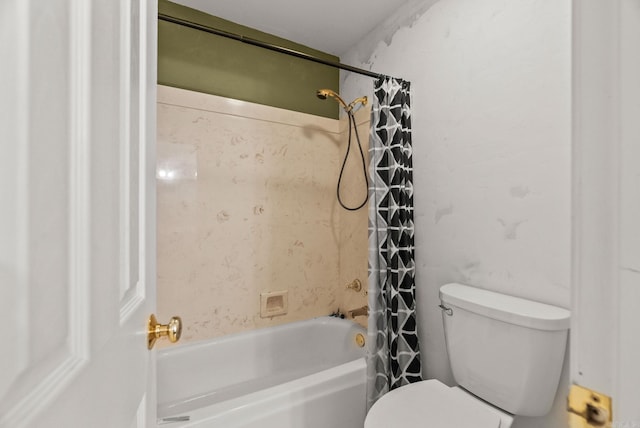 bathroom featuring toilet and shower / bath combination with curtain