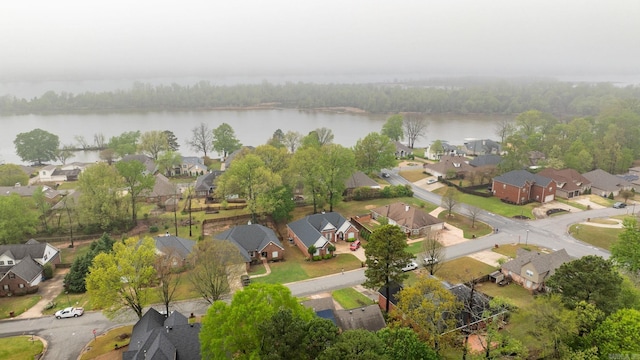 bird's eye view with a residential view and a water view