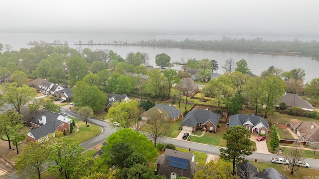 drone / aerial view with a water view and a residential view