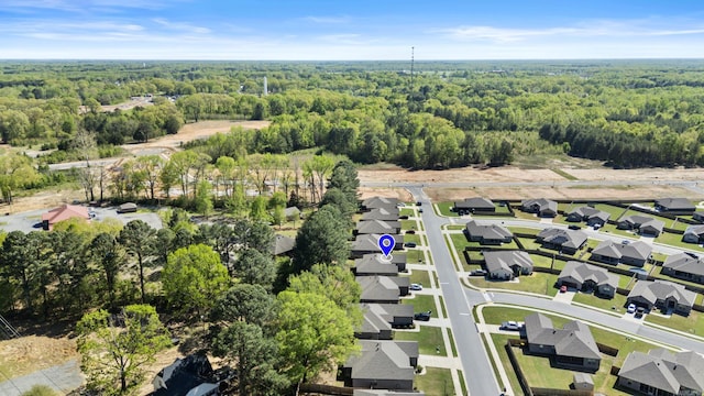 birds eye view of property with a wooded view and a residential view