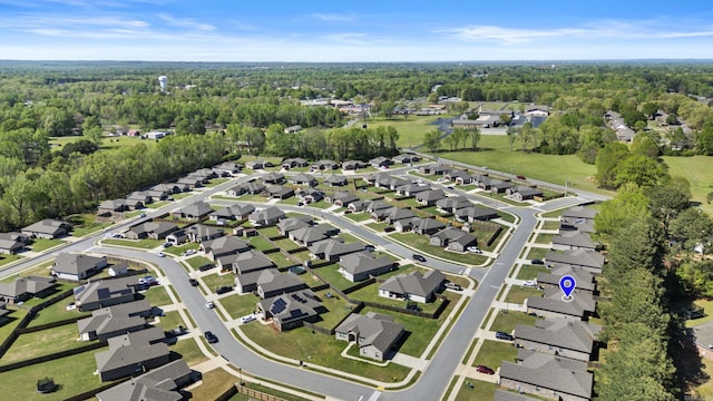aerial view with a wooded view and a residential view