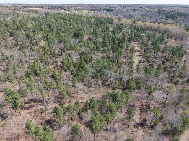 aerial view featuring a wooded view